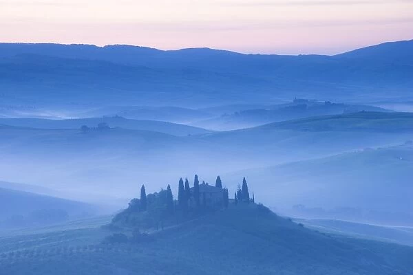 Misty dawn view towards Belvedere, across Val d Orcia, UNESCO World Heritage Site