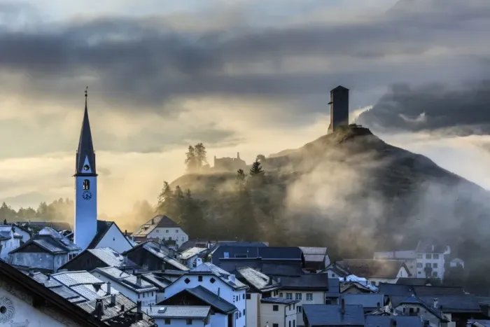 Framed Print : Misty sky on the alpine village of Ardez at sunrise, district of Inn, Lower Engadine Framed Print : Misty sky on the alpine village of Ardez at sunrise, district of Inn, Lower Engadine