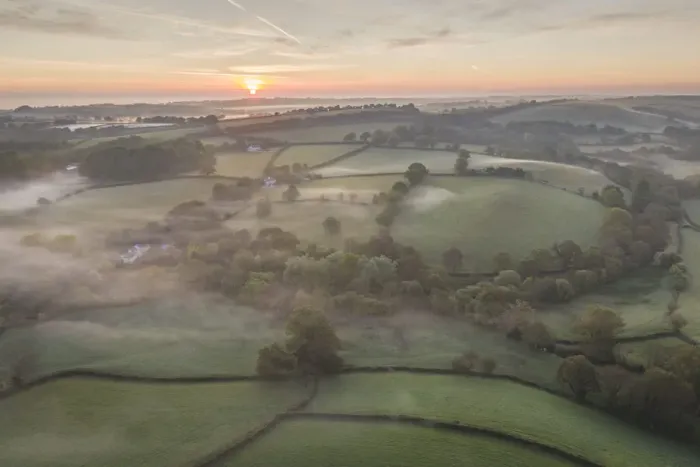 Framed Print : Misty spring sunrise over rolling countryside, South Tawton, Devon, England Framed Print : Misty spring sunrise over rolling countryside, South Tawton, Devon, England