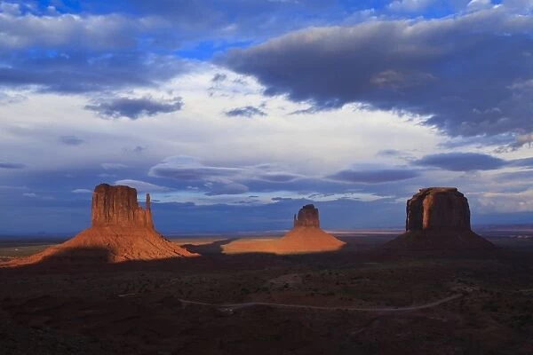 The Mittens at dusk cast long shadows, Monument Valley Navajo Tribal Park, Utah and Arizona border, United States of America, North America