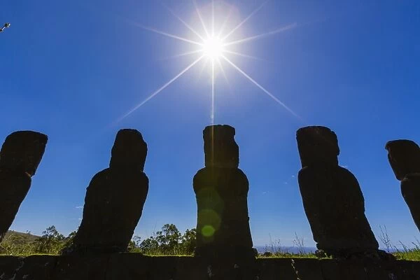 Detail of moai looking into the sun at Ahu Akivi, the first restored altar on Easter Island (Isla de Pascua) (Rapa Nui), UNESCO World Heritage Site, Chile, South America