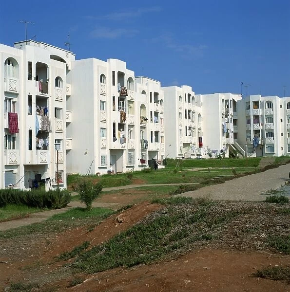 Modern apartments showing gardens and washing drying