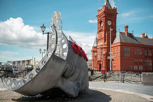 Modern sculpture and historic buildings at Cardiff's waterfront, Cardiff, Wales, United Kingdom, Europe