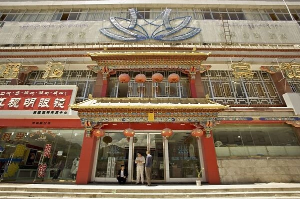 Modern shops line the Yutok Lam a street connecting the Jokhang temple to the Potala square