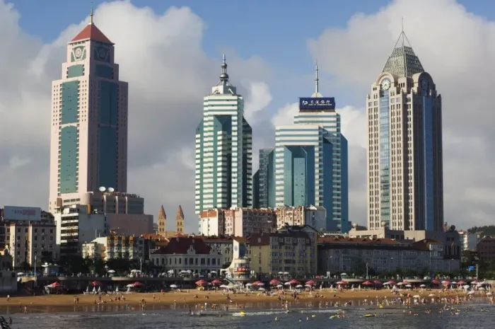 Framed Print : Modern skyscrapers in the seaside beach resort and host of the sailing events of the 2008 Olympic Games, Qingdao, Shandong Province Framed Print : Modern skyscrapers in the seaside beach resort and host of the sailing events of the 2008 Olympic Games, Qingdao, Shandong Province
