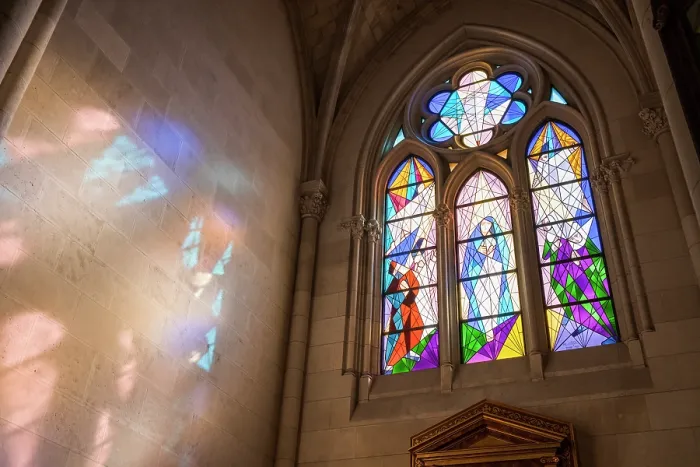 Framed Print : Modern stained glass window casting light on a wall in Catedral de Santa Maria la Real de la Almudena, Madrid, Spain Framed Print : Modern stained glass window casting light on a wall in Catedral de Santa Maria la Real de la Almudena, Madrid, Spain
