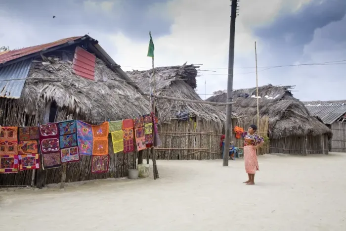 Framed Print : Molas hanging up for sale outside thatched houses, Isla Tigre, San Blas Islands Framed Print : Molas hanging up for sale outside thatched houses, Isla Tigre, San Blas Islands
