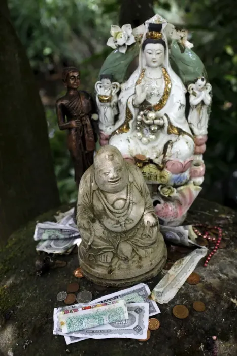 Framed Print : Money offering and statues in the garden of Buddhapadipa temple, Wimbledon, London Framed Print : Money offering and statues in the garden of Buddhapadipa temple, Wimbledon, London