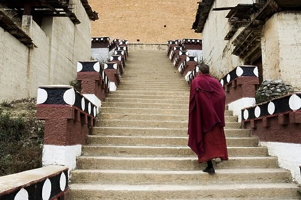 Monk climbing stairs, Gedan Song Zanling Temple, Shangri-La (Zhongdian)