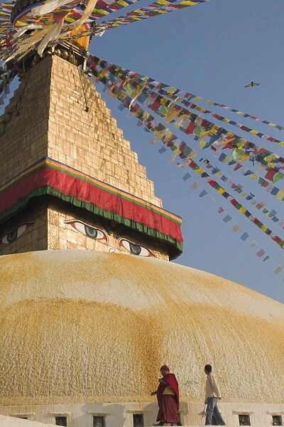 Monk and man walking around the stupa during Lhosar