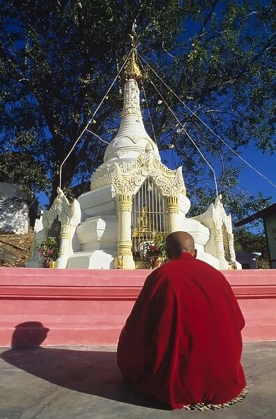 Monk praying, Pyilonchantha Pagoda, Mount Popa, Myanmar (Burma), Asia