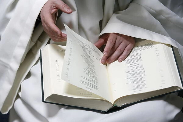 Monk reading the Bible, Evian, Haute Savoie, France, Europe