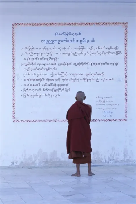 Framed Print : Monk reading Burmese wall script, Shwedagon, Yangon (Rangoon), Myanmar (Burma), Asia