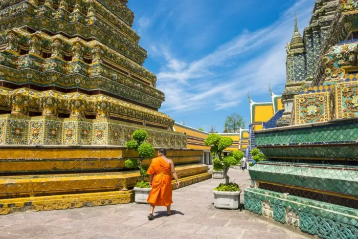 Framed Print : A monk walks past stupas at Wat Pho (Temple of the Reclining Buddha), Bangkok, Thailand Framed Print : A monk walks past stupas at Wat Pho (Temple of the Reclining Buddha), Bangkok, Thailand