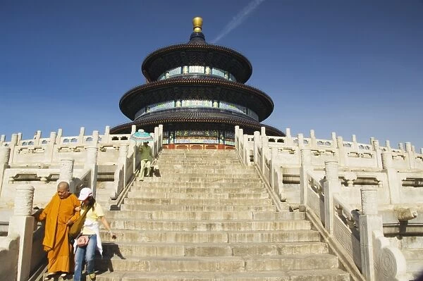 A monk walks down the steps at the Hall of Prayer for Good Harvests, The Temple of Heaven