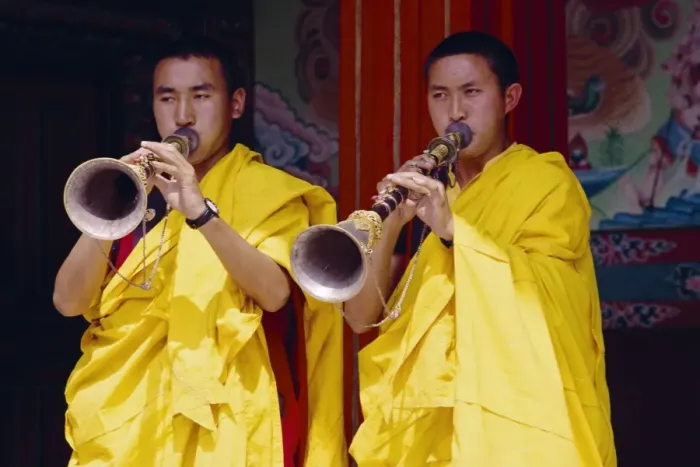 Framed Print : Monks blowing flutes outside a gompa (Tibetan monastery) Framed Print : Monks blowing flutes outside a gompa (Tibetan monastery)