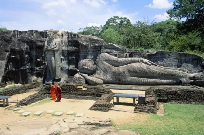 Framed Print : Two monks in front of Buddha statue