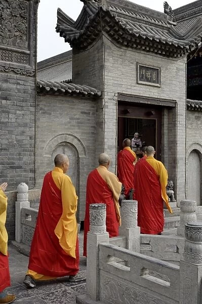 Monks going to pray at the Great Wild Goose Pagoda (Dayanta), dating from the Tang Dynasty in the 7th century, Xian, Shaanxi