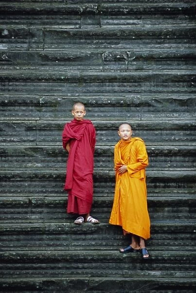 Monks on steps, Angkor Wat, Siem Reap, Cambodia, Indochina, Asia