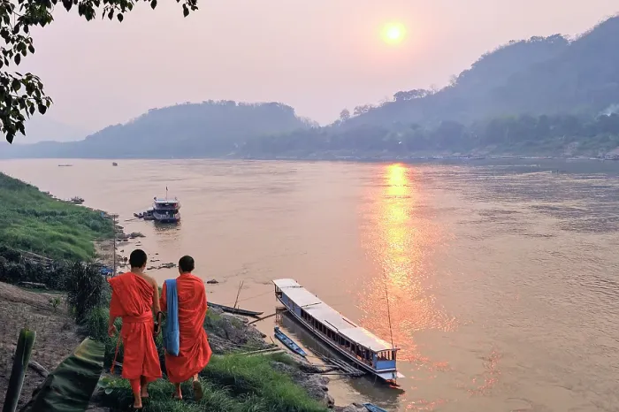Framed Print : Monks at sunset on Mekong River at Luang Prabang, Laos Framed Print : Monks at sunset on Mekong River at Luang Prabang, Laos