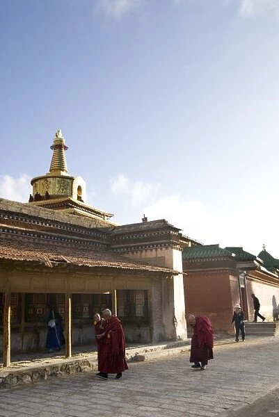 Monks walking, Xiahe monastery, Xiahe, Gansu, China, Asia