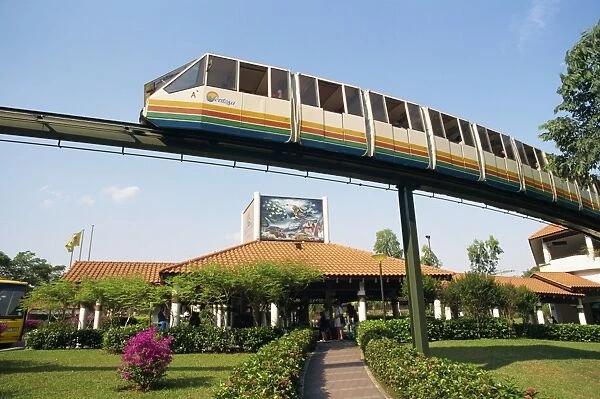 Monorail passes above Underwater World on Sentosa Island