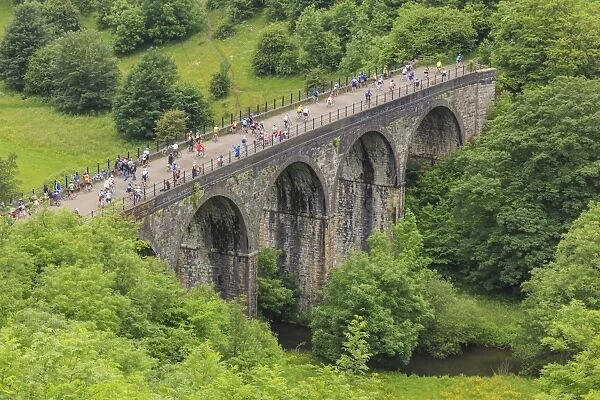 Monsal Trail, crowded with cyclists, former rail line viaduct over Monsal Dale at Monsal Head