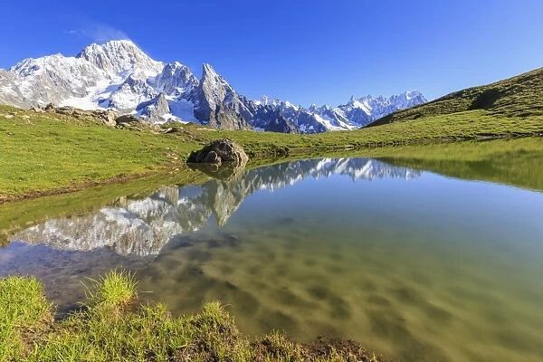 Mont Blanc group reflected in the Lac des Vesses (Vesses Lake), Veny Valley, Courmayeur