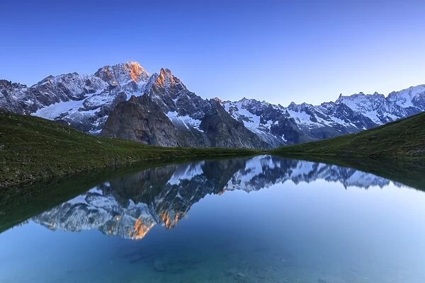 Mont Blanc reflected in Lac Checrouit (Checrouit Lake) at sunrise, Veny Valley, Courmayeur