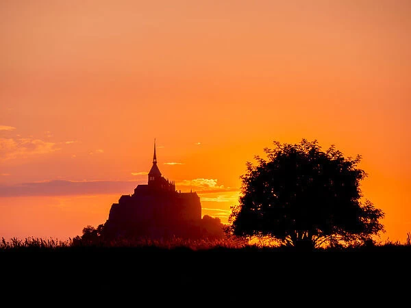 Mont St. Michel, UNESCO World Heritage Site, holy island and peninsula at sunset