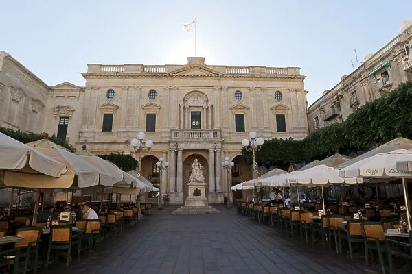Monument to Queen Victoria and an outdoor cafe in Republic Square, in front of the National Library, Valletta, Malta, Europe