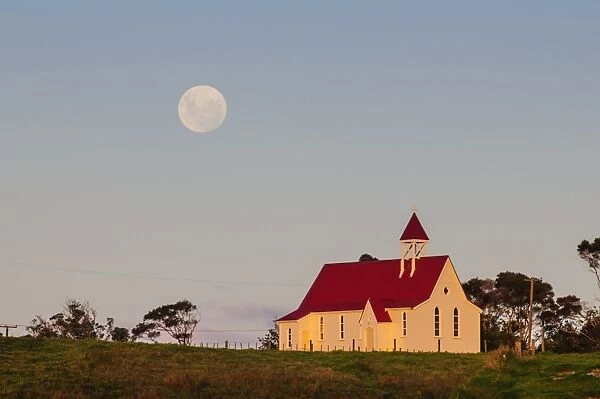 Full moon behind a little chapel, Westcoast, Northland, North Island, New Zealand, Pacific