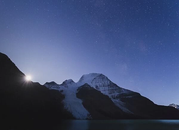 Moon rises over Mount Robson, the highest peak of the Canadian Rockies, UNESCO World Heritage Site