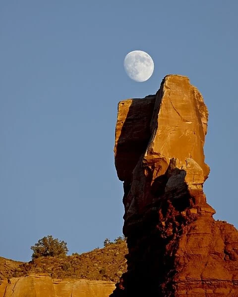 The moon rising over Chimney Rock, Capitol Reef National Park, Utah, United States of America