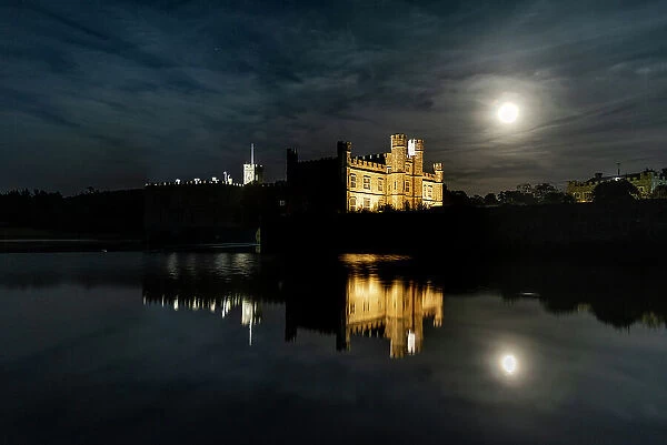 Full moon rising over Leeds Castle, near Maidstone, Kent, England, United Kingdom, Europe