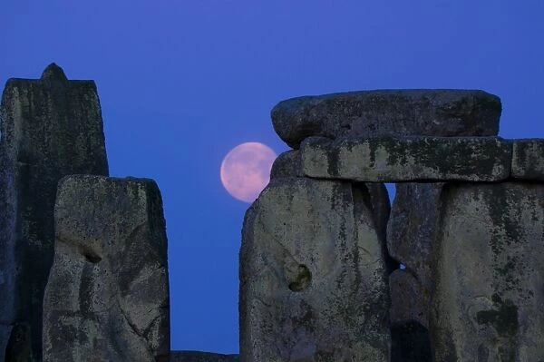 Moon behind Stonehenge, UNESCO World Heritage Site, Wiltshire, England