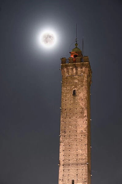 Full moon and Torre Asinelli, the highest tower of Bologna and symbol of the city