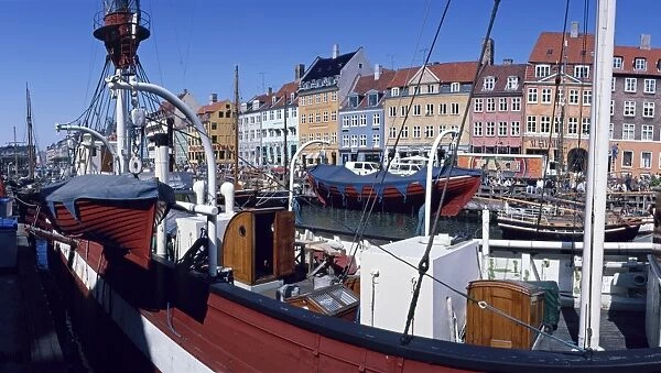 Moored boats and the waterfront of the Nyhavn Channel, the old harbour of Copenhagen