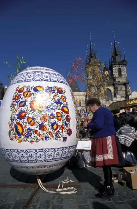 Framed Print : A Moravian woman decorating a large egg with Easter designs on the Old Town Square Framed Print : A Moravian woman decorating a large egg with Easter designs on the Old Town Square