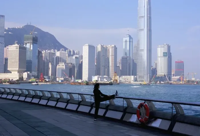 Framed Print : Morning exercise, Victoria Harbour and Hong Kong Island skyline, Hong Kong, China, Asia Framed Print : Morning exercise, Victoria Harbour and Hong Kong Island skyline, Hong Kong, China, Asia