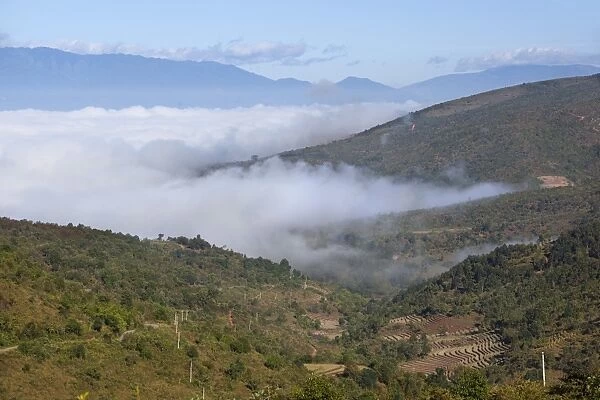 Morning fog over Kengtung and Shan hills on road to Loimwe, near Kengtung, Shan State, Myanmar (Burma), Asia