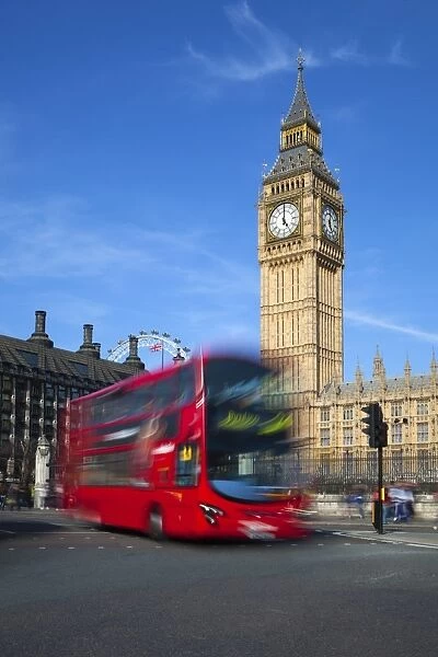 Motion blurred red London bus below Big Ben, Parliament Square, Westminster, London, England, United Kingdom, Europe