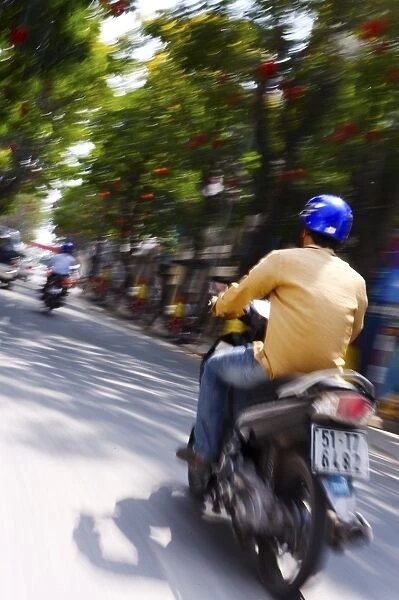 Motorbike on Ho Chi Minh Boulevard during Tet, Vietnam, Indochina, Southeast Asia, Asia