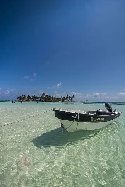Motorboat anchoring in the turquoise waters of El Acuario, San Andres, Caribbean Sea
