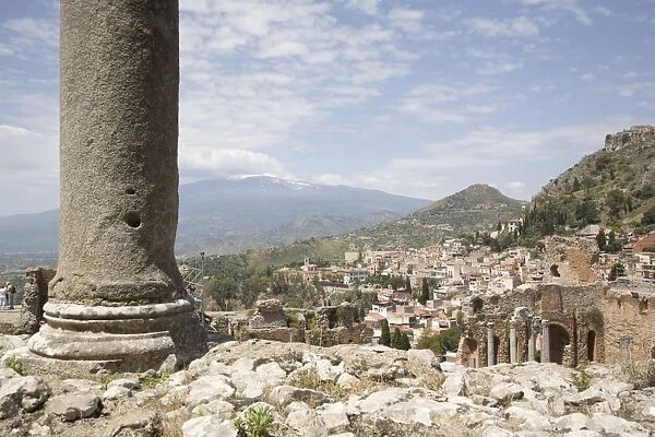 Mount Etna viewed from the Greek and Roman theatre, Taormina, Sicily, Italy, Europe