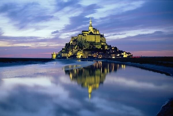 The mount by night reflected in water, Mont St Michel, Manche, Normandy