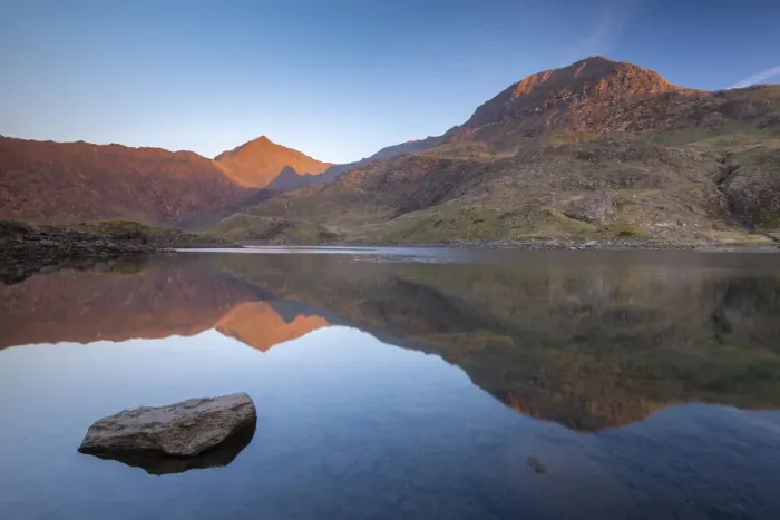 Framed Print : Mount Snowdon bathed in the first light of dawn in spring and reflected in Llyn Llydaw Framed Print : Mount Snowdon bathed in the first light of dawn in spring and reflected in Llyn Llydaw