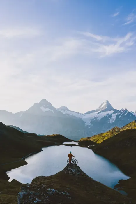 Framed Print : Mountain biker looking at Bachalpsee lake and Bernese Oberland mountains at dawn Framed Print : Mountain biker looking at Bachalpsee lake and Bernese Oberland mountains at dawn