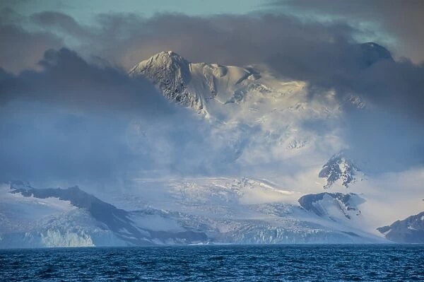 Mountain breaking through the clouds, Elephant Island, South Shetland Islands, Antarctica