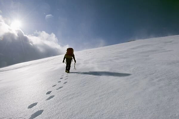 Mountain climber on snow covered Mount Fuji, Shizuoka Prefecture, Japan, Asia